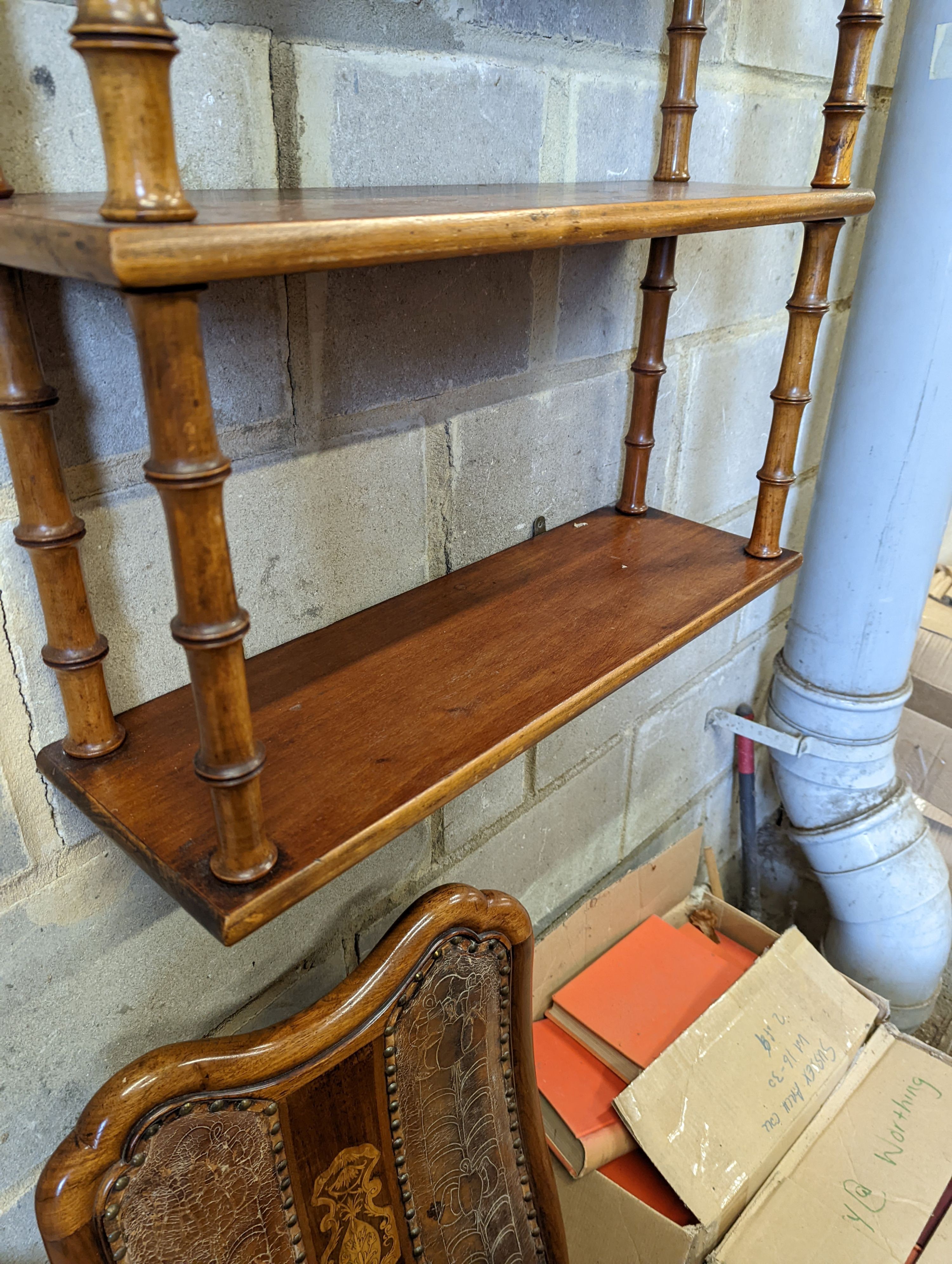 A Regency style mahogany four tier wall bracket, width 60cm, depth 19cm, height 80cm